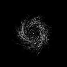 an abstract black and white photo with swirls in the center on a dark background