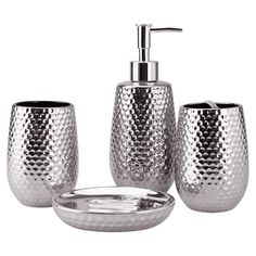 three pieces of bathroom accessories including a soap dispenser, toothbrush holder and bowl