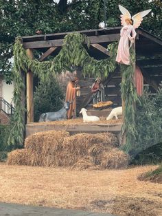 Nativity scene by the church Nativity Scene Christmas Parade Float, Outdoor Navity Scene Ideas, Christmas Crib Ideas Outdoor, Porch Nativity Scene, Outdoor Nativity Scene Diy Wood Christmas Yard, Live Nativity Scene Ideas Outdoor, Outdoor Manger Scenes Nativity Diy, Church Nativity Displays, Nativity Scene Display Outdoor