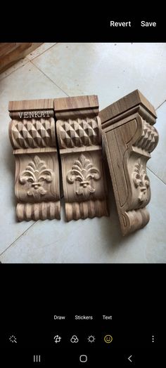 carved wooden corbs for sale on the floor in front of a tile floor