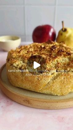 an apple pie sitting on top of a wooden cutting board