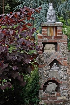 a brick oven in the middle of a garden