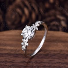 a diamond ring on top of a wooden table