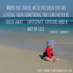 a baby sitting on top of a sandy beach next to the ocean with a quote