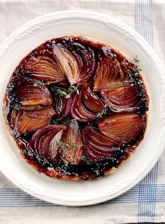 a white plate topped with an onion dish