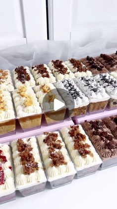 a display case filled with lots of different types of desserts on top of each other