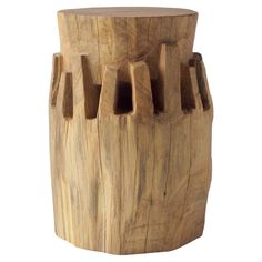 a wooden vase with holes in it