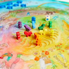 colorful toy train set sitting on top of a map