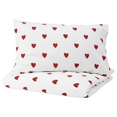 two pillows with red hearts on them