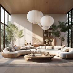 a living room filled with lots of furniture and large windows overlooking the outside patio area