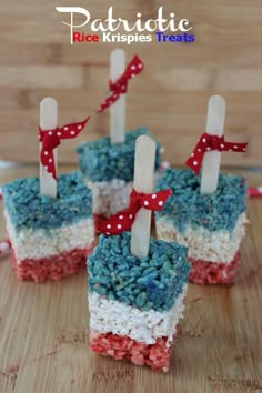 four red, white and blue cupcakes with candles