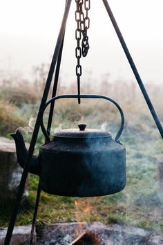 an old tea kettle is on the fire