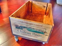 a wooden crate sitting on top of a hard wood floor