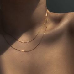 This silky Ultra Thin Snake Chain Necklace is giving us sexy vibes and we're totally unapologetic about it! This necklace can be layered up for a maximalist look, or worn alone it looks impeccable as it drapes over your collarbone. Add the Retro Rope Chain or the delicate clavicle choker - this necklace is a staple every girl needs in her jewelry box. DETAILS & SIZE Composition: 18k gold plated over 316L Stainless Steel Measurements: Thickness: 0.87mm; Length: 16" or 18" + 2" extension Lobster c Hot Necklaces, Diy Jewelry Gifts, Neck Chain, Gold Necklaces, Chain Choker Necklace, Jewelry Choker, Chain Gold, Choker Necklaces, Gold Plated Necklace