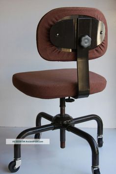 an office chair with wheels on the back