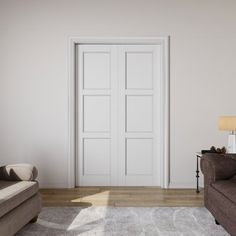 a living room with two brown couches and a white door in the corner that leads to another room