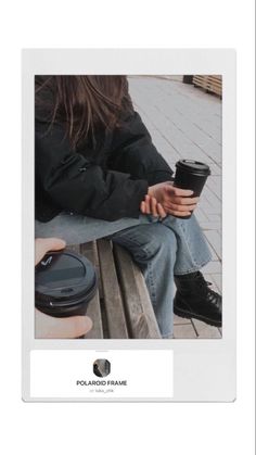 a person sitting on a bench holding a coffee cup