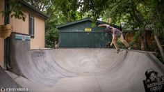 a man riding a skateboard up the side of a ramp