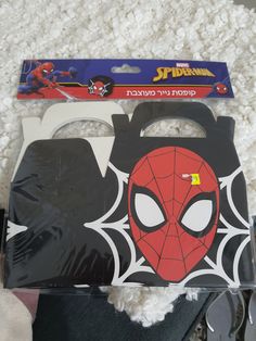 the spiderman mask is in its package and ready to be used as a decoration