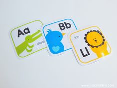 three stickers with animals and letters on them, one is for the letter b