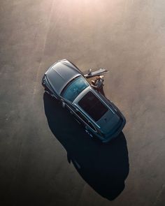 an overhead view of a car parked in the parking lot