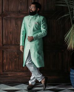 Raw silk, Mint green sherwani with invisible, front buttons Ankle length, white pants. Green Sherwani, Asian Men Fashion, Mens Sherwani, Historical Costume, South Asian, White Pants, Ankle Pants, Raw Silk, Ankle Length