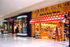 the inside of a toy store with people walking by