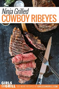 grilled steaks on a cutting board next to a knife and fork with the title, ninja grilled cowboy ribeyes