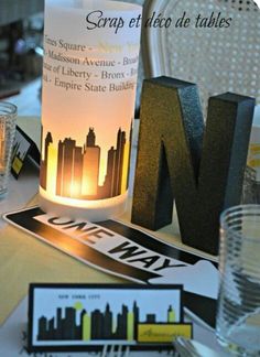 the table is set up for an event with place cards, napkins and candles