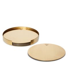 two round trays with gold rims on each side, one in the shape of a circle