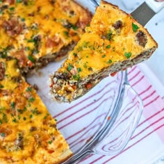 a slice of quiche on a plate with a fork