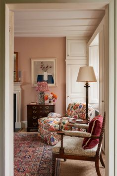 a living room filled with furniture and a lamp