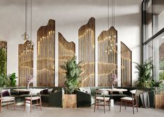 a room filled with lots of tables and chairs next to tall wooden wall dividers