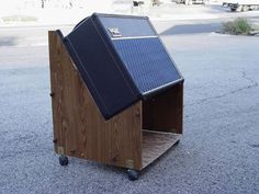 a wooden cart with a solar panel on top