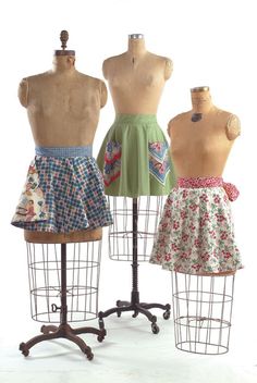 three mannequins with different designs on them