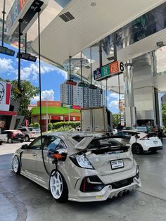 an electric car is charging at a gas station