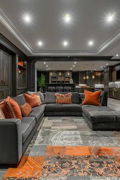 a living room filled with furniture and lots of pillows on top of carpeted flooring