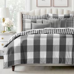 a black and white checkered comforter set on a bed