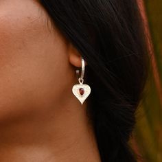 These drop heart hoops with red garnet are a reminder that 'I Am Loved'. Remind yourself, remind a loved one. Whoever these cute heart hoops are for, let them be your daily reminder. With removable heart charms, these versatile earrings also double up as a classic just-the-right-size hoop. Always be the first one to love yourself. Unconditionally. Set your vibration and let the love flow... Matching bracelet & pendant available. - Details - Hoop: 18mm Heart: 22mm (including bail) x 14mm Weight: 5.72g Material: Recycled sterling silver* Red Garnet *Hoop & heart charm are recycled, butterfly back is not recycled. - Social Impact - These earrings have been carefully crafted by a small team of marginalised artisans displaced from West Bengal, who have found sustainable livelihoods through thei Cotton Jewelry, Bracelet Pendant, Heart Hoop Earrings, Heart Drop Earrings, Matching Bracelet, Earrings Red, Stone Heart, Red Stone, Matching Bracelets