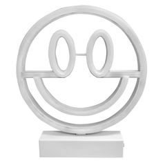 a white sculpture with the word o on it's face in front of a white background