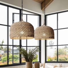 two lamps hanging from the ceiling in a living room