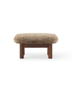 the foot stool is made from wood and fabric