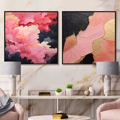 two paintings on the wall in a living room with pink chairs and a coffee table