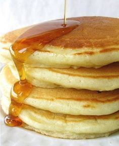 stack of pancakes with syrup being poured onto them and the caption reads pancakes are a sponge for syrup