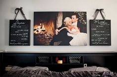 a bedroom with two pictures hanging on the wall