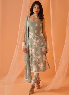 Our Dusty Green White Floral Printed Straight Suit includes a chanderi top, chanderi bottom, and a chanderi dupatta. Embroidery is present on this style using print and stone work. Like all of our pieces, this piece is made in India and checked by hand to ensure high quality. Sleeveless Suit Design, Suit Designs Indian Style Neck, Suit Designs Indian Style, Suit Neck Designs, Dusty Green, Kurti Designs Party Wear, Kurta Designs Women, Embroidered Dupatta