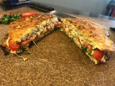 a sandwich cut in half sitting on top of a counter