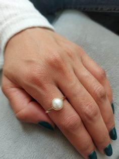 Pearl Solid Gold ring. This handmade gold engagement ring with Pearl is made of 14K genuine gold and set with pearl This 14 karat gold ring can serve as an engagement ring or a birthday gift, bridesmaid. * Gemstone -Natural pear pearl size: Pearl 8 mm round * Metal - 14K genuine gold . * Beautifully packaged, ready for gift giving. I make all my items with care and professionalism which I learnt from my father and grandfather. I am 4 generation of jewelers and all my knowledge can be seen in my Real Pearl Ring, Classic 14k Gold Pearl Ring With Open Design, Elegant Pearl Ring With Bezel Setting For Formal Occasions, Elegant Pearl Ring With Bezel Setting For Formal Events, Classic 14k Gold Pearl Open Ring, Classic Yellow Gold Rings With Pearl Drop, Elegant Formal Pearl Ring With Bezel Setting, Classic Yellow Gold Pearl Promise Ring, Elegant Oval Pearl Ring With Bezel Setting