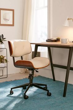 an office chair sitting in front of a desk with a lamp on top of it