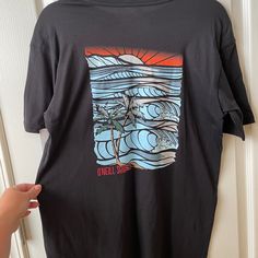 Nwt Men’s O’neill Surf Co. Core Surf Graphic Black T-Shirt Size Small. 100% Cotton. Chest Measurement Is 20 Inches Across And Length Is 27. 5 Inches Long. Black Surfing T-shirt With Screen Print, Black Graphic Print T-shirt For Surfing, Black Graphic Tee For Surfing, Black Screen Print Surfing T-shirt, Casual Black T-shirt For Surfing, Black Crew Neck Surfing Top, Black Crew Neck Top For Surfing, Black Relaxed Fit T-shirt For Surfing, Black Screen Print Tops For Beach